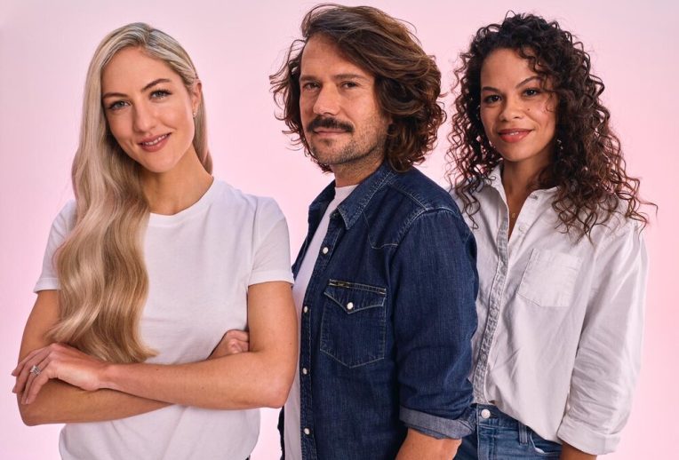 Dr Megan Rossi in a lab looking through a microscope