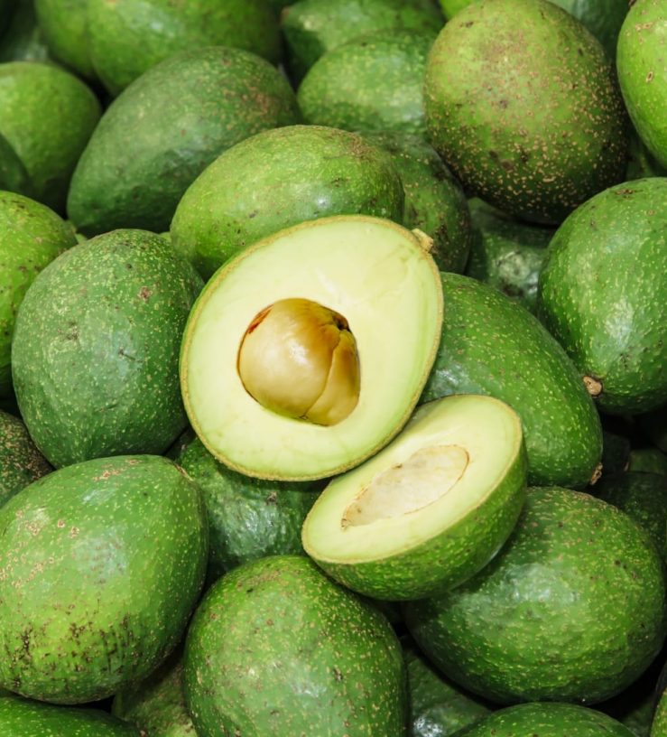 A photo of a pile of avocados