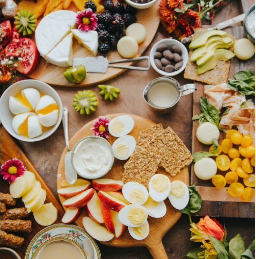 Dr Megan Rossi in a lab looking through a microscope
