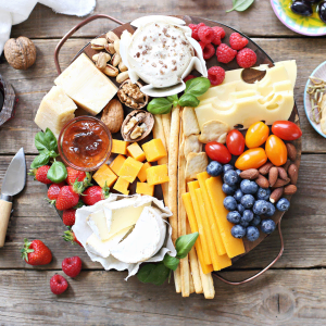 Photo of a plant-diverse platter including fruit and cheeses to show workplace wellbeing