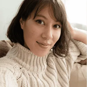 A photo of Rachael smiling, she has short brown hair and brown eyes