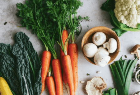 Mixed vegetables shown on a bench to demonstrate options included within vegan diet
